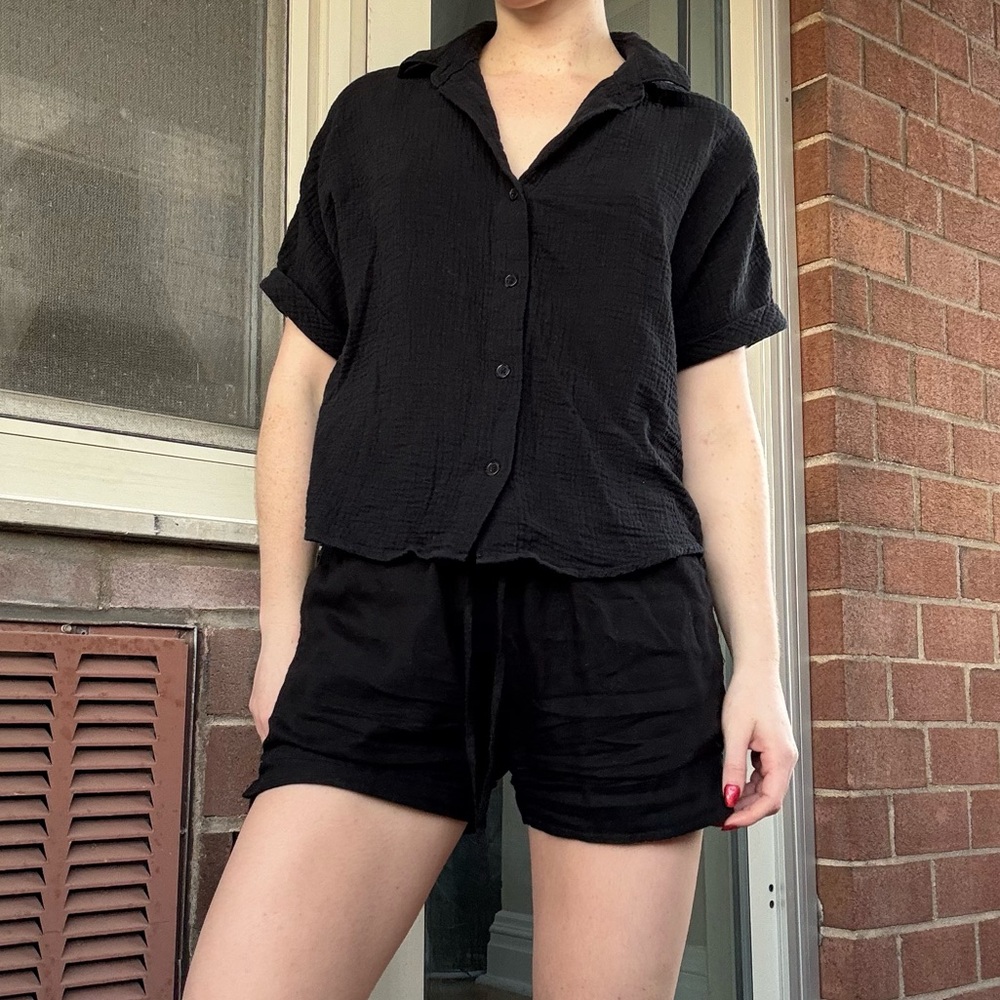 Black linen button-down shirt.
